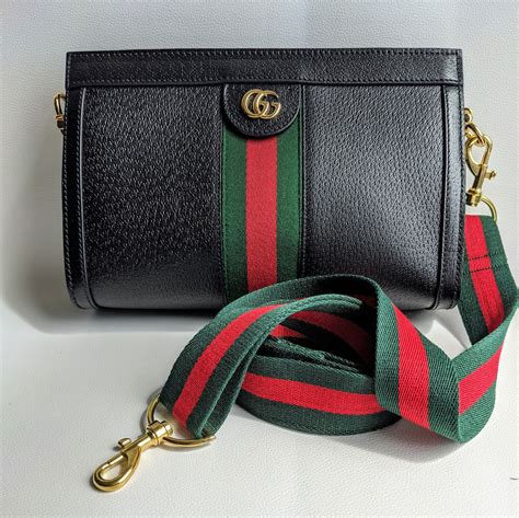 gucci bag with strap.